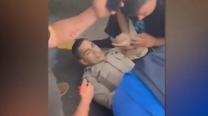 Good Samaritans rush to help CHP officer shot with his own gun