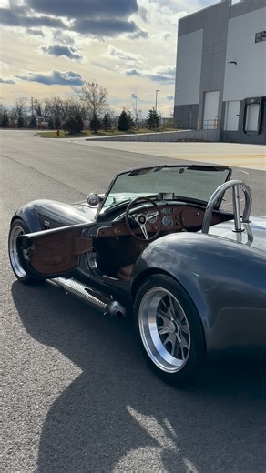 Jonathan Motorcars on Instagram: "Final Test Drive‼️1965 @backdraft_racing Cobra 🐍 Magnetic Grey / Silver Stripes / Tobacco X-Stitch / @prestige_moto 427 500HP #JMCCobra #shelby #cobra JMC is your Official Backdraft Racing Dealer! ☎️609-871-2700 💻JMCCobra.com"