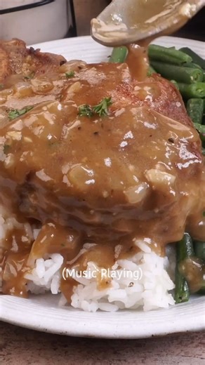 These smothered pork chops are fall-apart tender and covered in the richest, savory onion gravy 🤤 Serve them over mashed potatoes or rice and dinner is DONE. Comment RECIPE 👇 | Butter Your Biscuit