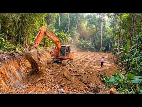 Using An Excavator To Clear Roads And Level The Ground To Build A New House In The Forest