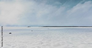 Cars Driving on the frozen lake in Canada, Drone, close to the ground, in 4k