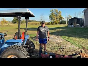 Learning how to attach a bush hog and making a first pass at the trails!