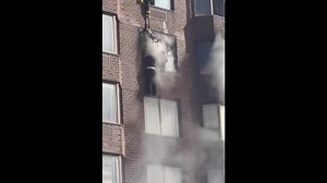 Footage shows person dangling from window in NYC fire