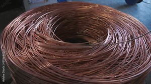 The drawing process of copper wire at the factory for the production of electric cable.