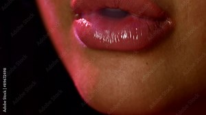 Beautiful woman lips smoking a hookah. Close up. side view