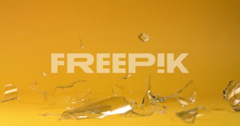 Shattered Glass on Yellow Background | Premium Stock Video Footage