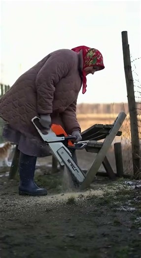 Grandma is sawing an old bench.