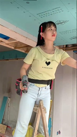 Female carpenter installing a light steel suspended ceiling#woodworking #diy #usashorts #renovation