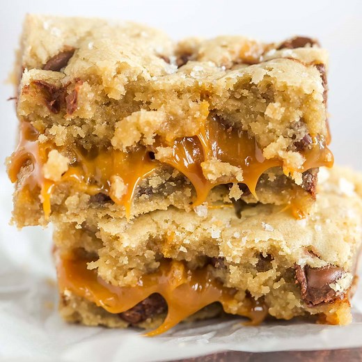 SALTED CARAMEL CHOCOLATE CHIP COOKIE BARS are sweet and salty heaven! 🙌🏻 FULL RECIPE >> https://www.browneyedbaker.com/salted-caramel-chocolate-chip-cookie-bars/ | Brown Eyed Baker