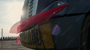 Oversize load banner and red flag on flatbed trailer. Close up shot