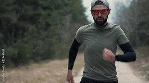 Running Man Cardio Fitness Training.Marathon Runner Jog.Workout Sport Concept.Runner Man Fit Athlete Legs Jogging.Triathlete Running,Sprinting On Endurance Marathon Sport Workout Triathlon Competition