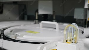 Modern laboratory machine automatically checks blood samples at hospital. Laboratory equipment, immunoassay and clinical chemistry analyzer, chemical pathology, medical biochemistry, blood and urine