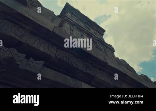 Exploring the artistic stone carvings of the 9th-century Prambanan temple, depicting sacred stories and cultural motifs of ancient Java Stock Video Footage - Alamy