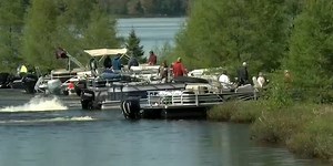 Floating island? Wisconsin community members use personal boats to move giant floating bog