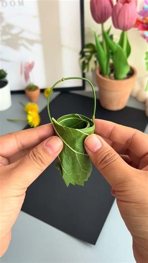 It’s easy and fun to make a small spring flower basket with a leaf. Bring your children to decor