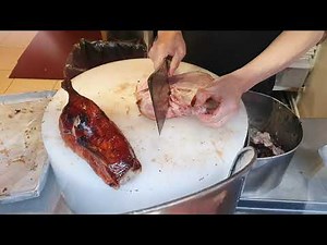 Amazing professional chopping of a Beijing duck Cantonese roast duck Chinese Asian Cooking