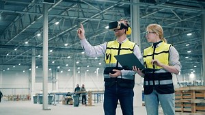 Employees using virtual reality. VR, 3d reality at industrial factory facility.