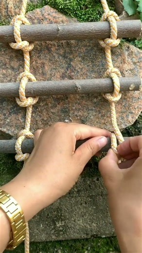 Creating a unique ladder from rope and wood, combining creativity with functional design.