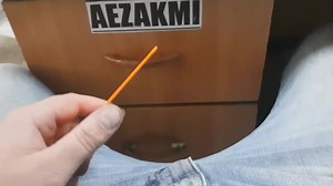 Close-Up Hand Measuring Object with Ruler