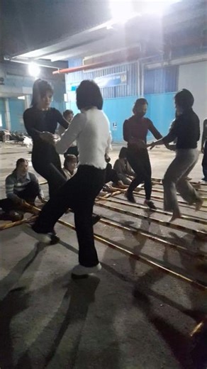 Second step on the bamboo dance