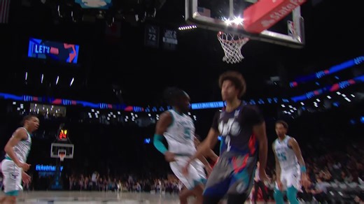 Cameron Johnson rises up for the dunk