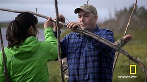Chip Hailstone teaches his two daughters, Qutan and Carol, how to make a brush house out of willow branches. New episodes of #LifeBelowZero air Tuesdays at 8/7c on National Geographic. | Life Below Zero