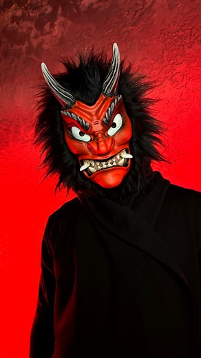 Japanese Demon mask: Red Namahage with Black Fur Namahage masks are traditional Japanese masks originating from the Oga Peninsula in Akita Prefecture. 👹They are worn by men dressed as fearsome demons, with straw capes and frightening faces, during a winter festival held on New Year’s Eve. It is believed that the Namahage visit homes to scare lazy children and young people, warning them to be hardworking and obedient in the coming year. In reality, it is a ritual of cleansing and protection — th