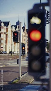 Street Intersection With Red Traffic Lights And Moving Car