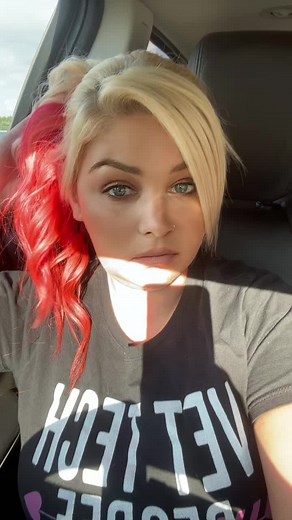 Stunning Hairstyle with Red Highlights in Natural Light