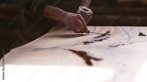 manufacture of exclusive furniture from solid wood. wood processing with epoxy resin, varnish. ancient technology.