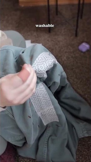 Fixing the thighs of my pants with visible mending