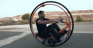 life-size custom electric monowheel made of motorcycle tires can balance itself as it glides