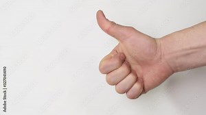 Thumbs up sign hand gesture on white background. Simbol of approval like positive emotion. Close up.