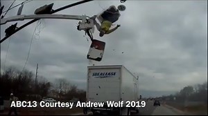 VIDEO: Truck slams into cherry picker at Texas intersection, leaves worker dangling