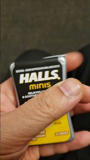 Halls minis sugar free lemon honey flavor cough drops out of the card board packaging.