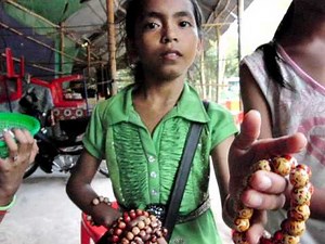 Cambodia - Children begging you to buy something