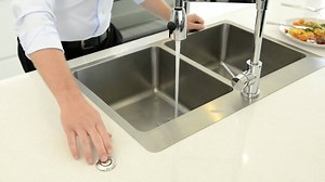 Simply turn on your cold tap, put the food scraps into your sink and feed them into the InSinkErator® flange that replaces your normal plughole. Turn on the food waste disposer and at the touch of a button the food waste is ground down and flushed away, quickly quietly and efficiently. | InSinkErator UK