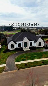 This custom built home showcases a crisp white exterior with white stone brick accents and an open layout featuring porcelain finishes The expansive master suite leads you to a covered porch overlooking the backyard, seamlessly blending indoor and outdoor design. Would you live here? Builder: @sapphireluxuryhomes Landscaping: @sapphirelandscaping Agent: @realtysolutionsofmi Video: @wayup_media #luxuryhomes #realestate #homebuilder #interiordesign #moderndesign #customhomes #custombuilder | Sapph