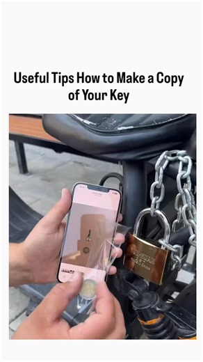 Explainer_Zone on Instagram: "The post features a 20-second video tutorial from @Rainmaker1973 demonstrating a DIY key duplication hack: photograph the key on a phone, trace its outline with clear tape on the screen, transfer to plastic, cut with scissors, and use it to unlock a basic padlock. This technique, popularized on social media since at least 2016, creates a temporary plastic shim that works for simple, low-security locks with straight cuts but fails on complex or high-security ones due