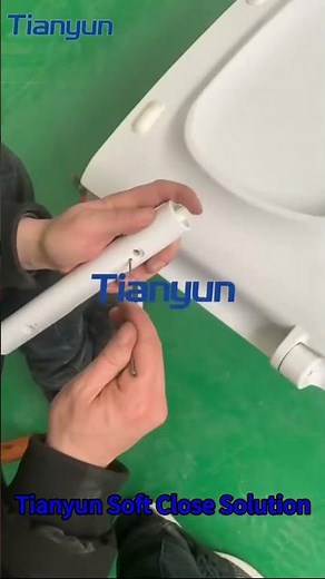 Engineer Installing a Soft Close Damper into a Toilet Seat – See How It’s Done