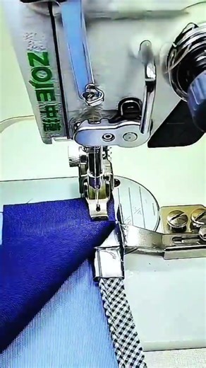Precision guiding checkered fabric through ZOJE sewing machine