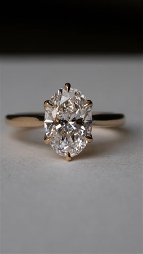 Em Shum | Custom Engagement Rings + Fine Jewellery on Instagram: "Simple yet hidden with details - floral basket with mill graining and diamonds on bridge. Engraved are their initals along with their birthstones. A personal touch only they will know. The details: - Oval diamond - Overlapping floral basket - 18k yellow gold - Bridge detailing - Hidden birthstones #sydneyjeweller #customengagementring #timelessdesign #engagementringinspo"