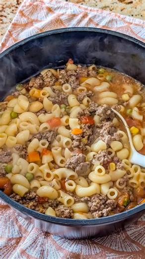 Dish Name: Beef Macaroni Vegetable Soup Ingredients - 500 g ground beef - 1 cup elbow macaroni - 1 small onion (chopped) - 2 cloves garlic (minced) - 1 cup carrots (diced) - ½ cup peas - ½ cup corn - 1 cup diced tomatoes - 5 cups beef broth - 1 tbsp olive oil - 1 tsp paprika - ½ tsp dried oregano - ½ tsp salt - ½ tsp black pepper Recipe 1. Heat olive oil in a large pot over medium heat. 2. Add chopped onion and cook for 2–3 minutes until softened. 3. Stir in minced garlic and cook for 30 seconds