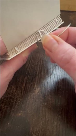 Stitching the pages together for my handmade notebook