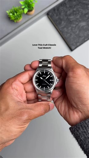 Time Scope by Eldhose George on Instagram: "The Sinn 556i is a masterclass in functional minimalism, a watch that distils German tool watch design down to its purest form. With its clean, glossy black dial and sparse layout, every element serves a purpose, resulting in exceptional clarity and effortless readability. Applied indices and finely proportioned hands are filled with luminous material, ensuring the time remains instantly legible in all conditions. The discreet date window blends seamle