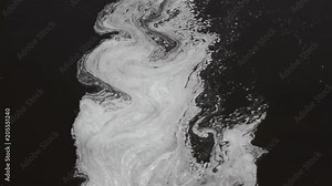 Plume of foam floating on rapid river. Constantly changing macro pattern, stochastic process, connecting statics (microlevel) and dynamics (macrolevel). View from top. Result of water pollution