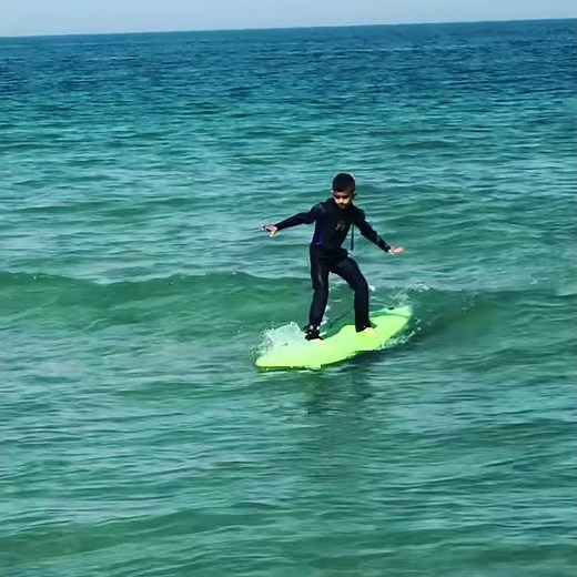 Kids surfing learning to surf kid trying to surf surfing for the first time