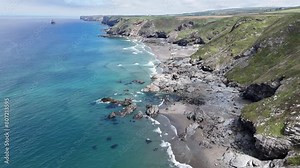 4K aerial footage of north cornwall coastline showing cliffs beaches rocks sea and surf