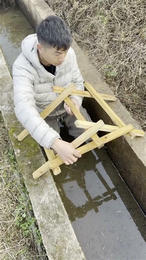 What happens when you put a big rock on a stick ladder?