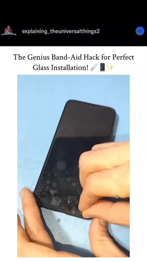 Explains_Universal_Things on Instagram: "This 31-second tutorial shows a clever DIY method for changing a phone’s glass protector. It begins with the user removing the old, cracked protector to start with a fresh surface. The Hack: To ensure perfect alignment, the user places two one-time bandages (Band-Aids) on the left side of the phone’s back. The new glass paper is then positioned precisely on top of the screen. - The Process: A third bandage is applied to the right side, securing the new gl